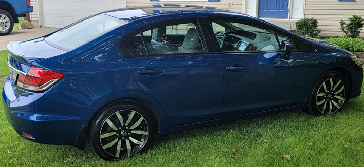 Next-Level Shine: Hybrid Solutions PRO Graphene Flex Wax on a 2015 Blue Honda Civic 4 door.